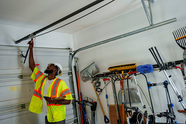 Professional Garage Door Panel Replacement technician working in Ellis County County, KS
